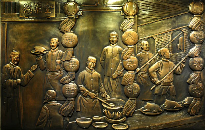 Bas-relief en bronze de la rôtisserie des débuts